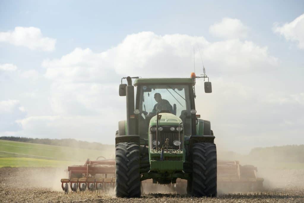 Tractor Prepa ring Soil